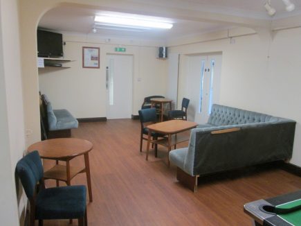 villageroom2-upholstered1 To the right can be seen the double doors which when opened up create a through room with the Barnes Wallis Hall